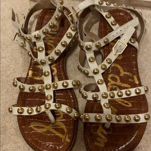 Off white gladiator sandals with gold accents